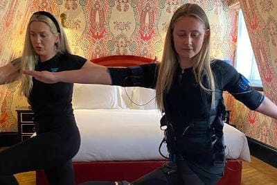 EMS exercise being performed in a hotel suite by Vive Fitness personal
