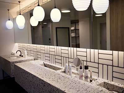 The high-end, contemporary bathroom and vanity area at the Vive Fitness studios.