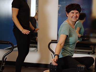 Reformer Pilates personal training session featuring two women at Vive Fitness in London.